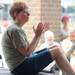 Ann Arbor resident Sue McDonald claps during the musical performance of The Potter's Field. Angela J. Cesere | AnnArbor.com 