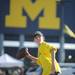 13-year-old Ann Arbor resident Stewart Brabbs throws a football before the Michigan football game against Notre Dame on Sept. 10, 2011. Angela J. Cesere | AnnArbor.com
