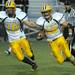 Saline tight end Joey Wooley, left, blocks for the running back Joel Strobbe as he runs with the ball during the football game against Pioneer at Pioneer High School on Sept. 16, 2011. Angela J. Cesere | AnnArbor.com