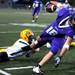 Saline defensive back Ryan Brown drags down Pioneer tight end Tommy Pokorney during the football game at Pioneer High School on Sept. 16, 2011. Angela J. Cesere | AnnArbor.com