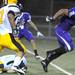 Pioneer running back Drake Johnson, right, escapes the grips of defensive back Brandon Gordon as he runs down the field during the football game at Pioneer High School on Sept. 16, 2011. Angela J. Cesere | AnnArbor.com