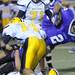 Saline defensive back Griffin Arbour (14) helps take down Pioneer running back Drake Johnson during the football game at Pioneer High School on Sept. 16, 2011. Angela J. Cesere | AnnArbor.com
