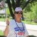 Ypsilanti resident Karen Jania walks in the Ann Arbor Relay for Life with a photo of her friend Joan Caldwell, who passed away last September from breast cancer. Angela J. Cesere | AnnArbor.com
