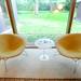 Chairs next to large windows in the living room of the home designed by architect Robert Metcalf. Angela J. Cesere | AnnArbor.com
