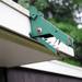 A wooden tyrannosaurus head on the outside of the home designed by architect Robert Metcalf. Angela J. Cesere | AnnArbor.com