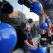 Ann Arbor resident Patricia Alvis sits next to blue beach ball decorations before the new water sculpture at City Hall was unveiled on Oct. 4, 2011. The beach balls echo a design element of the water sculpture. Angela J. Cesere | AnnArbor.com