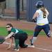 EMU first baseman Amanda Herron reaches to grab the ball to get out Michigan infielder Ashley Lane at first. Angela J. Cesere | AnnArbor.com
