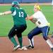Michigan junior Ashley Lane, right, loses the ball as she tries to tag out EMU freshman Amanda Herron. Angela J. Cesere | AnnArbor.com
