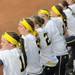  Michigan sophomore Lyndsay Doyle, far left, and senior Bree Evans, to her right, watch Michigan fielding against EMU.   Angela J. Cesere | AnnArbor.com
