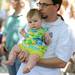 Ypsilanti resident Pat Maier dances with his 7-month-old daughter, Molly, during Laith Al-Saadi's performance at Sonic Lunch. Angela J. Cesere | AnnArbor.com
