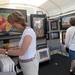 Battlecreek resident Julie Awkerman browses through the fiber art of Michael Lewis at Ann Arbor's South University Art Fair on South University. Angela J. Cesere | AnnArbor.com 