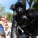 Detroit resident Jai McCrary, left, looks at a giant gorilla sculpture made of welded masonry nails by Bill Secunda at Ann Arbor's South Universty Art Fair on South University. Angela J. Cesere | AnnArbor.com 