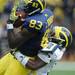 Junior wide receiver Jerald Robinson catches a pass while junior Courtney Avery tries to tackle him. Angela J. Cesere | AnnArbor.com
