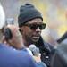 University of Michigan alumn and former NFL wide receiver Desmond Howard talks to reporters on the sidelines during the Michigan football spring game. Angela J. Cesere | AnnArbor.com
