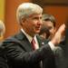 Michigan Governor Rick Snyder greets people on the House floor before delivering his State of the State address at the State Capitol in Lansing. Angela J. Cesere