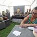 Kathleen Braunschweiger-Piel writes the booth number and art fair on her business cards inside her booth displaying wood turnings by her and Jorn Piel at the Ann Arbor Street Art Fair on Ingalls Mall. Angela J. Cesere | AnnArbor.com 