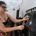 Artist Michelle Harris sets out pieces of jewelry made from found objects at the Ann Arbor Summer Art Fair on Liberty. Angela J. Cesere | AnnArbor.com 