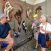 Florida artist Alan Gibson, left, talks with Lansing residents Lesly and Tom Jordan about his wall sculptures at his booth on Main Street at the Ann Arbor Summer Art Fair. Angela J. Cesere | AnnArbor.com 