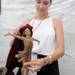 Artist Angela Mia De La Vega cleans off her sculpture of a girl at inside her booth at the Ann Arbor Summer Art Fair on Main St. Angela J. Cesere | AnnArbor.com 