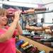 Cincinnati resident Anna Lawson looks through a kaleidoscope made by artists Peggy and Steve Kittelson at the Ann Arbor Summer Art Fair on Main Street. Angela J. Cesere | AnnArbor.com 