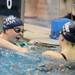 Saline's Nikki Flynn, left, talks with teammate Kate Rogers after finishing heat 3 of the 100 yard freestyle. AnnArbor.com | Angela J. Cesere