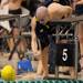 Saline's Adam Whitener shakes hands with teammate James Fisher after Fisher placed first in the championship heat of the boys 100 yard freestyle at the MHSAA swim and dive chapionships at Eastern Michigan University. Angela J. Cesere | AnnArbor.com

