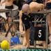 Saline's Adam Whitener shakes hands with teammate James Fisher after Fisher placed first in the championship heat of the boys 100 yard freestyle at the MHSAA swim and dive chapionships at Eastern Michigan University. Angela J. Cesere | AnnArbor.com
