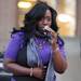 Christina Crawford, a member of the band I-Khonz, sings "I Will Survive" on the steps of Hatcher Graduate Library for the Take Back the Night rally in Ann Arbor. Angela J. Cesere | AnnArbor.com
