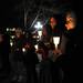 University of Michigan alumna Leslie Garrison, right, holds a candle and sings "Lean on Me" during the take back the night rally in Ann Arbor. Angela J. Cesere | AnnArbor.com
