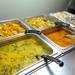 Clockwise from lower left: dal palak, kadai tofu, potato poriyal, naan, vegetable noodles, and sambar on the lunch buffet at Taste of India Suvai. Angela J. Cesere | AnnArbor.com