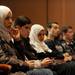 From left: Eastern Michigan University studen Layla Al Madan, University of Michigan librarian Eryn Kropf, and EMU student Arwa Al Madan listen as Tawakkul Karman gives her speech. Angela J. Cesere | AnnArbor.com