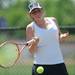 Huron's Melanie Langa swings at the ball in the 2 doubles match against Saline at a tournament at Pioneer High School on Wednesday afternoon. Angela J. Cesere | AnnArbor.com
