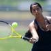 Pioneer's Azba Gurm swings at the ball in the 2 singles match against Skyline's Megan Smith at a tournament at Pioneer High School on Wednesday afternoon. Angela J. Cesere | AnnArbor.com