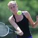 Pioneer's Julia Rampton swings at the ball in the 1 doubles match against Huron at a tournament at Pioneer High School on Wednesday afternoon. Angela J. Cesere | AnnArbor.com