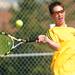 Saline's Spencer Kennedy competes in the 1st doubles semi-finals against Pioneer during tennis regionals at Pioneer High School on Oct. 7, 2011. Angela J. Cesere | AnnArbor.com