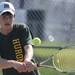 Huron's Ben Brenner competes in the 4th doubles semi-finals against Salem during tennis regionals at Pioneer High School on Oct. 7, 2011. Angela J. Cesere | AnnArbor.com 
