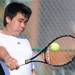 Plymouth's Aaron Zhang hits the ball in a 1st singles match against Huron's Jack Petersen at the tennis regionals at Pioneer High School on Oct. 7, 2011. Angela J. Cesere | AnnArbor.com