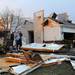 People move belongings out of a house on the corner of Meadow View and York St. in Dexter after a tornado struck their home. Angela J. Cesere | AnnArbor.com
