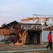 A man walks by a house that was leveled on York St. and Noble Dr. in Dexter after a tornado hit the neighborhood. Angela J. Cesere | AnnArbor.com
