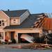 A house on Noble Dr. was damaged after a tornado touched down in the Huron Farms neighborhood in Dexter.  Angela J. Cesere | AnnArbor.com
