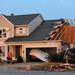 A house on Noble Dr. was damaged after a tornado touched down in the Huron Farms neighborhood in Dexter.  Angela J. Cesere | AnnArbor.com
