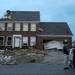  People stand outside of a home on Noble Dr. in Huron Farms neighborhood in Dexter after a tornado touched down. Angela J. Cesere | AnnArbor.com
`