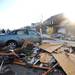 A car sits on Noble St. with debris around it in Huron Farms neighborhood after a tornado hit Dexter, Mich. on March 16, 2012.  Angela J. Cesere | AnnArbor.com
