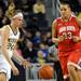 Ohio state center Ashley Adams, right, looks on as Michigan guard Jenny Ryan dribble the ball. Angela J. Cesere | AnnArbor.com