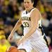Michigan guard Carmen Reynolds dribbles down the court. Angela J. Cesere | AnnArbor.com