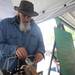 Gary Toler, owner of Never Dull Sharpening, sharpens knives at his stand in the Ann Arbor Farmer's Market. Angela J. Cesere | AnnArbor.com