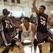 River Rouge's James Walker, left, and Devonte Johnson, right, defend against Willow Run's Jamal Poplar during the MHSAA boys basketball regional finals at Manchester High School on Wednesday evening.  Angela J. Cesere | AnnArbor.com
