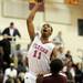 Willow Run's Anthony Davis jumps above River Rouge's James Walker to take a shot. Angela J. Cesere | AnnArbor.com
