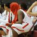 Willow Run basketball players Tyler Brooks, center left, and Raigan Hall, right, lament their 53 - 26 loss to River Rouge at the end of the MHSAA regional final's match. Angela J. Cesere | AnnArbor.com
