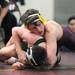 Dexter's Alex Reich, right, tries to keep down Freeland's Cavin Compton during the 140 lb weight class match. Angela J. Cesere